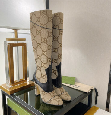 gucci high heel python print boots