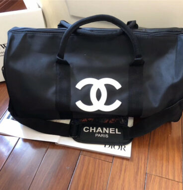 chanel logo luggage bag