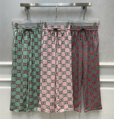 gucci all over letter print casual trousers