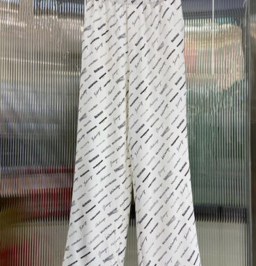 Balenciaga all over logo print trim casual trousers