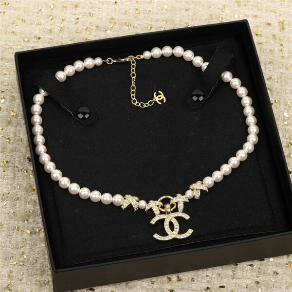 chanel cross pearl necklace