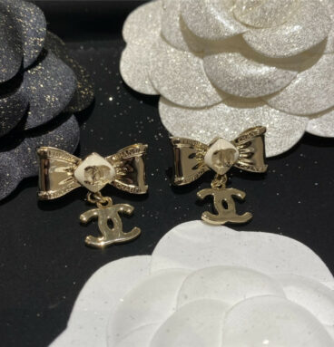 Chanel creamy white bow earrings