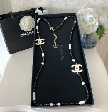 chanel black and white sweater chain