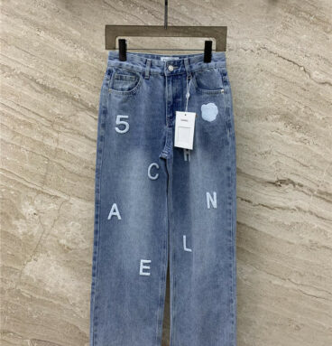 chanel towel embroidered logo jeans
