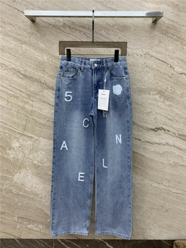 chanel towel embroidered logo jeans