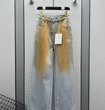 chanel distressed washed mud-dyed jeans