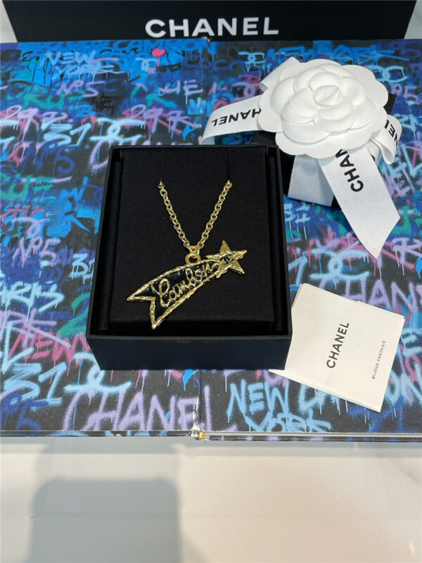 chanel black gold letter lava star necklace