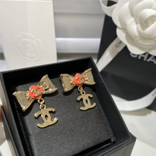 Chanel orange bow engraved earrings